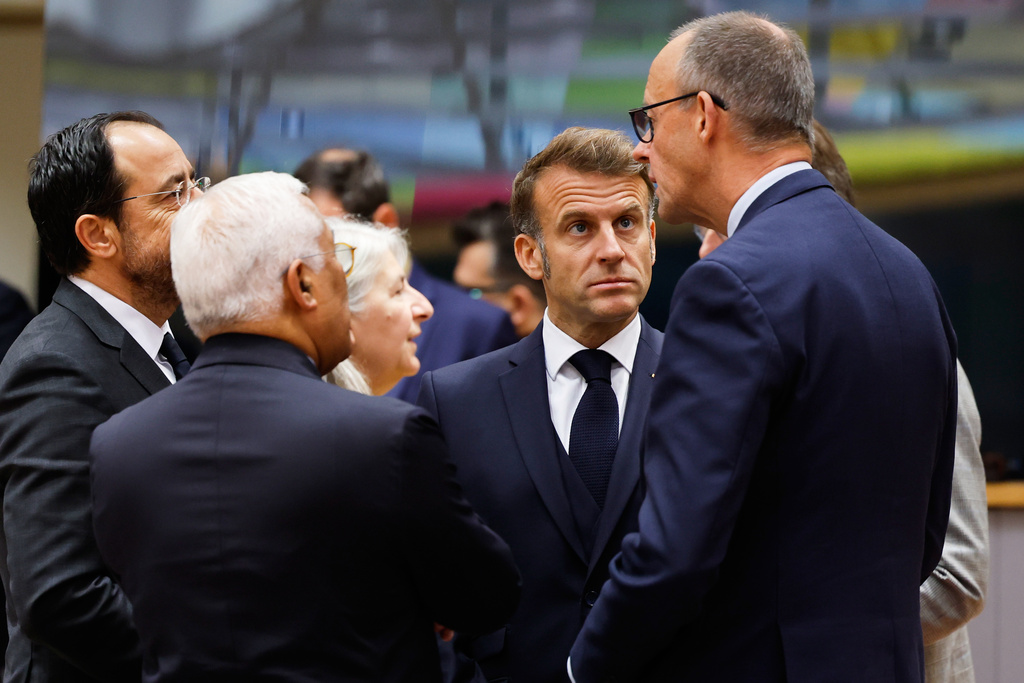 Germany's Chancellor Friedrich Merz, right, speaks with from left, Cypriot President Nikos Christodoulides, European Council President Antonio Costa and French President Emmanuel Macron during a round table meeting at an EU Summit in Brussels, Thursday, Oct. 23, 2025. (AP Photo/Geert Vanden Wijngaert)