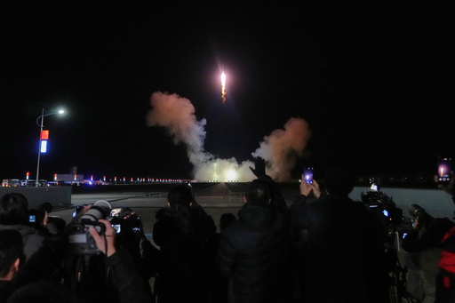 Journalists film China's Long March 2F rocket, carrying three astronauts for the Shenzhou 21 manned space mission, lifts off for a space station, at the Jiuquan Satellite Launch Center in Jiuquan, northwestern China, Friday, Oct. 31, 2025. (AP Photo/Andy Wong) Journalists film China's Long March 2F rocket, carrying three astronauts for the Shenzhou 21 manned space mission, lifts off for a space station, at the Jiuquan Satellite Launch Center in Jiuquan, northwestern China, Friday, Oct. 31, 2025. (AP Photo/Andy Wong)