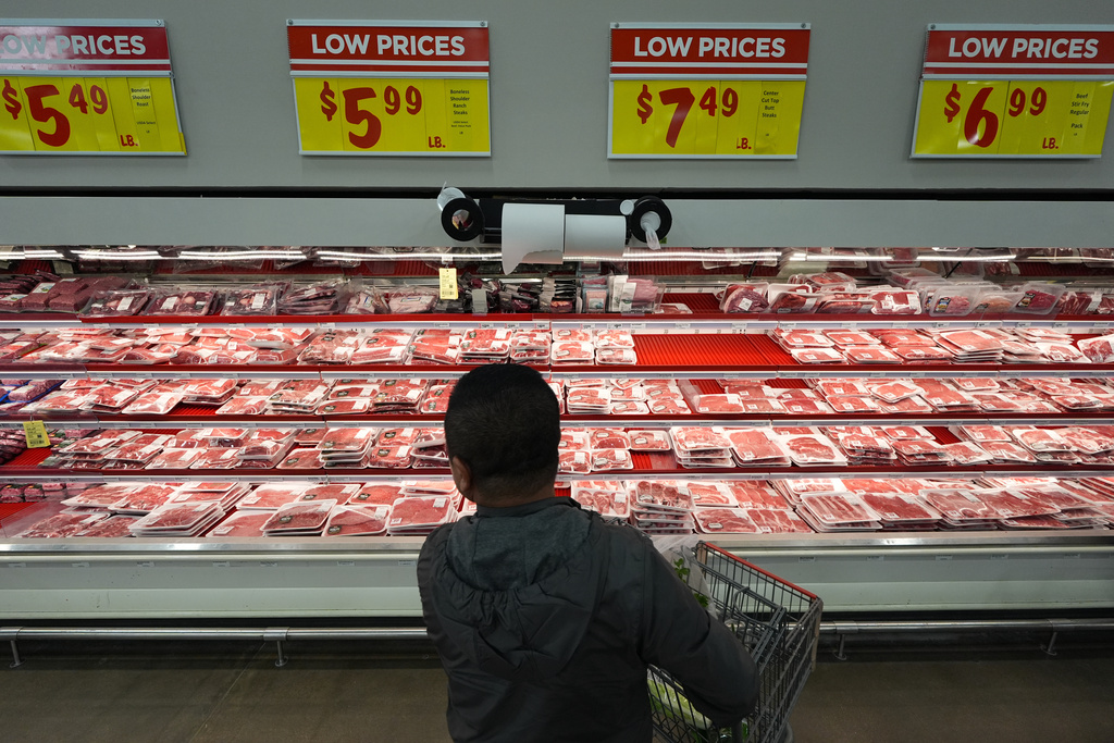 Former Chinese official Li Chuanliang shops for meat at a supermarket in Midland, Texas, Jan. 20, 2025. (AP Photo/Rebecca Blackwell)