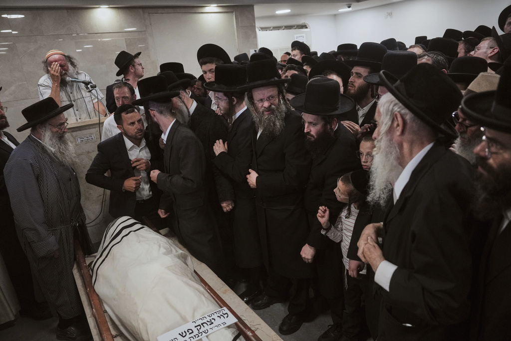 Mourners attend the funeral of Levi Yitzhak Pash, who was killed along with five other Israelis in a shooting attack by two Palestinian gunmen at a bus stop in Jerusalem Monday, Sept. 8, 2025. (AP Photo/Ariel Schalit)