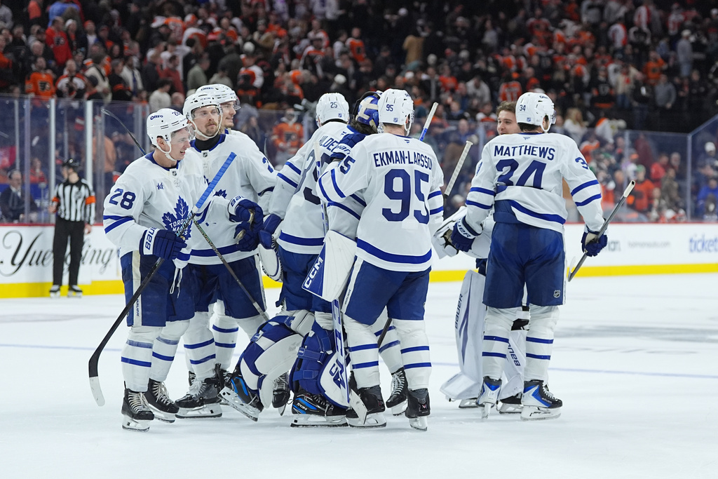 The Toronto Maple Leafs celebrate the win in sudden death overtime against against the Philadelphia Flyers after an NHL hockey game, Thursday, Jan. 8, 2026, in Philadelphia. (AP Photo/Matt Rourke)